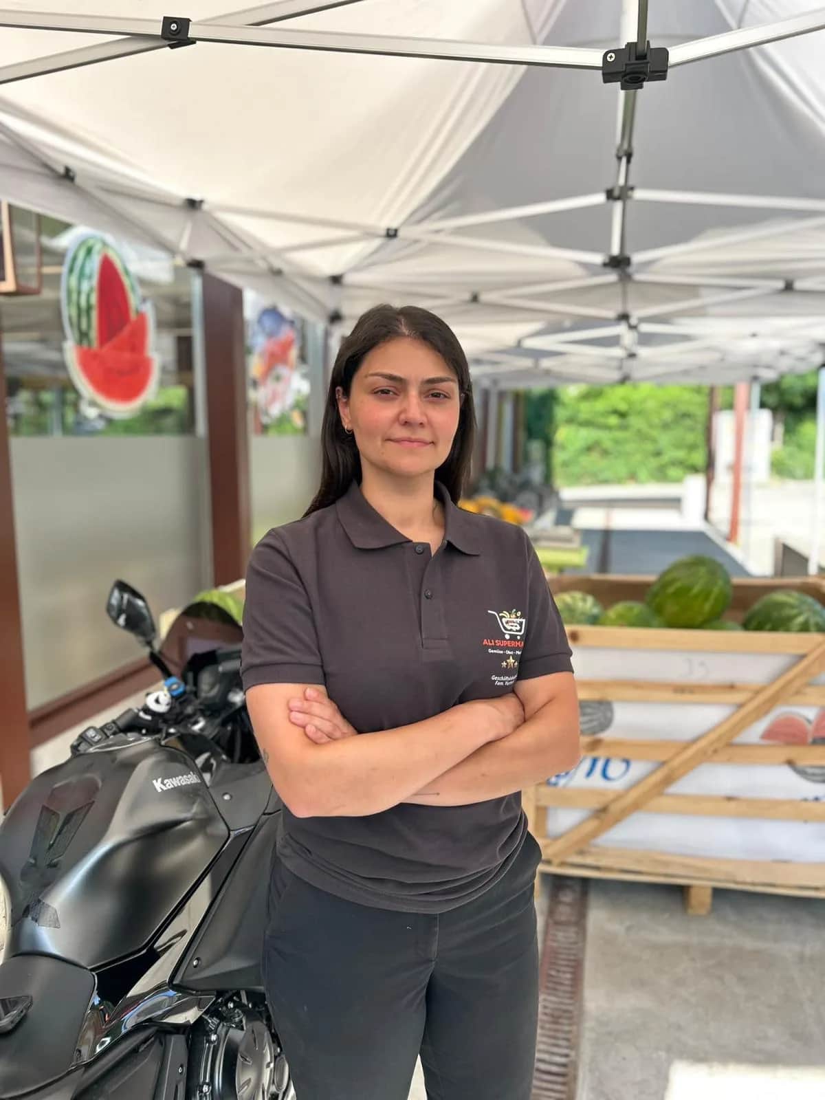 Kader Yurteri, owner of Ali Supermarkt GmbH, outside the shop in Flamatt